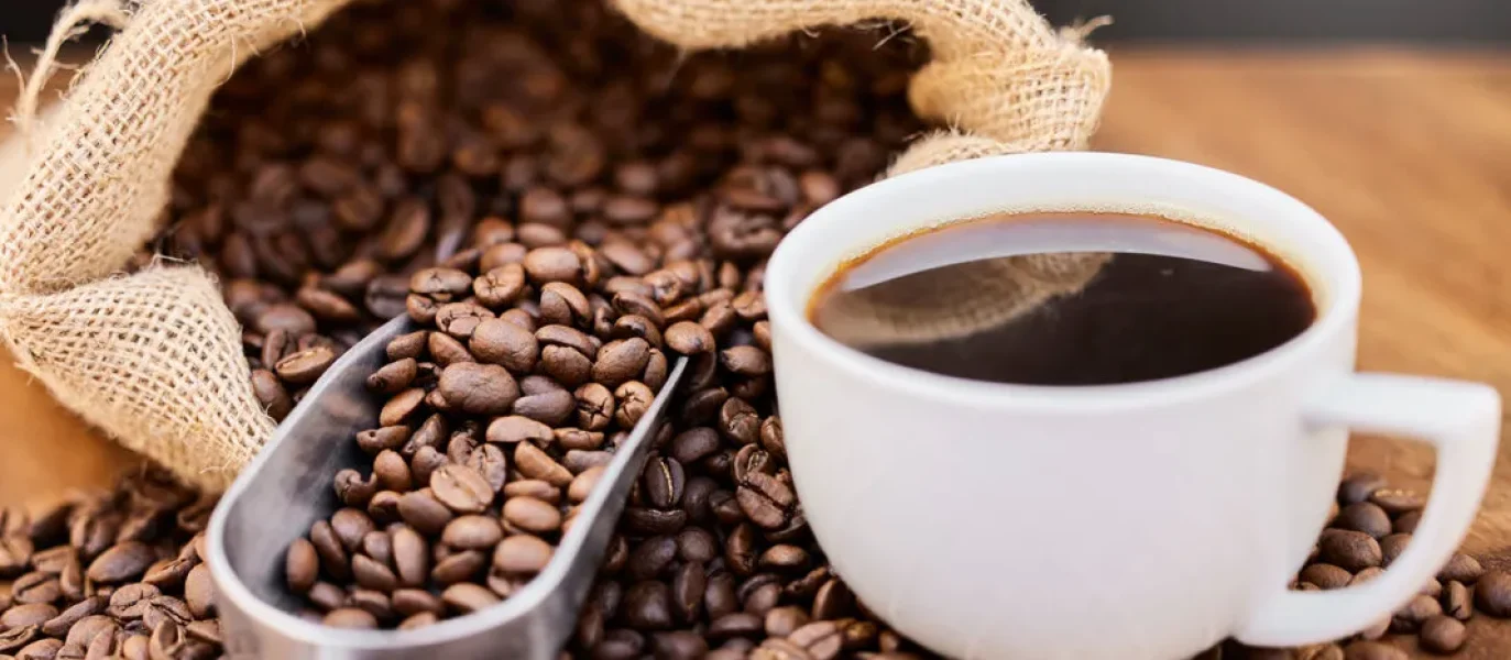 iStock-coffee-beans-and-black-coffee-1068x724.jpg