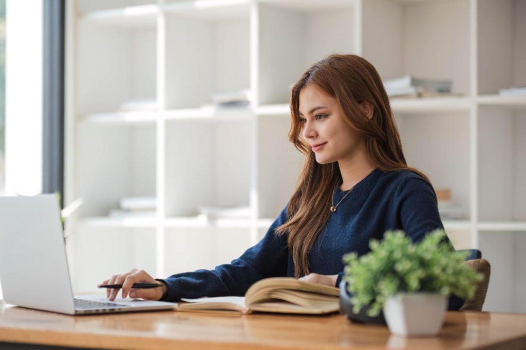 girl with a laptop studying from his home